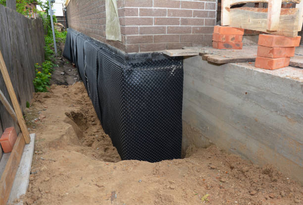 SJ Waterproofing Pros technician performing targeted Waterproofing assessment in Roslyn, NY